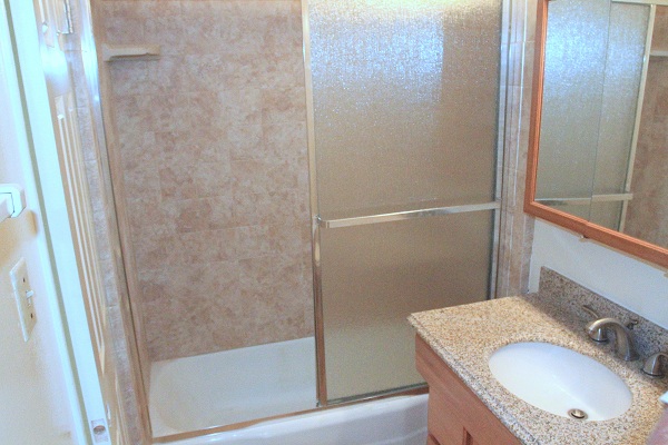 New bathroom with granite counters and marble floors