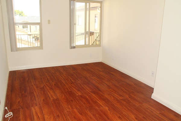 Bedroom with hardwood floor (to be installed prior to occupancy)